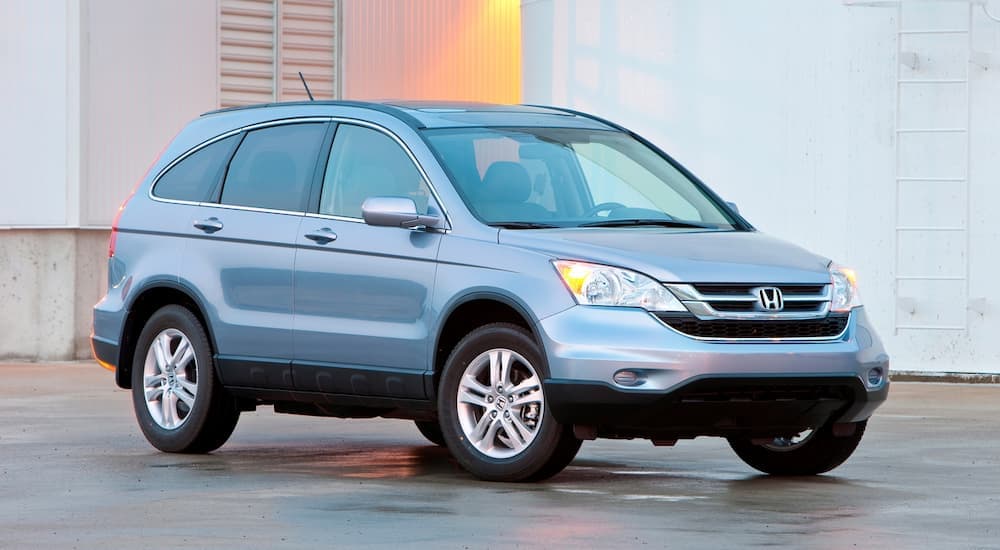 A blue 2011 Honda CR-V parked outside a used Honda dealer near Calhoun.