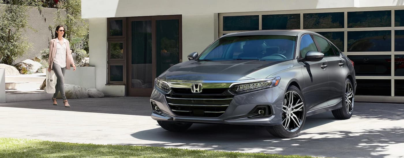 A grey 2020 Honda Accord Touring is parked in a driveway.