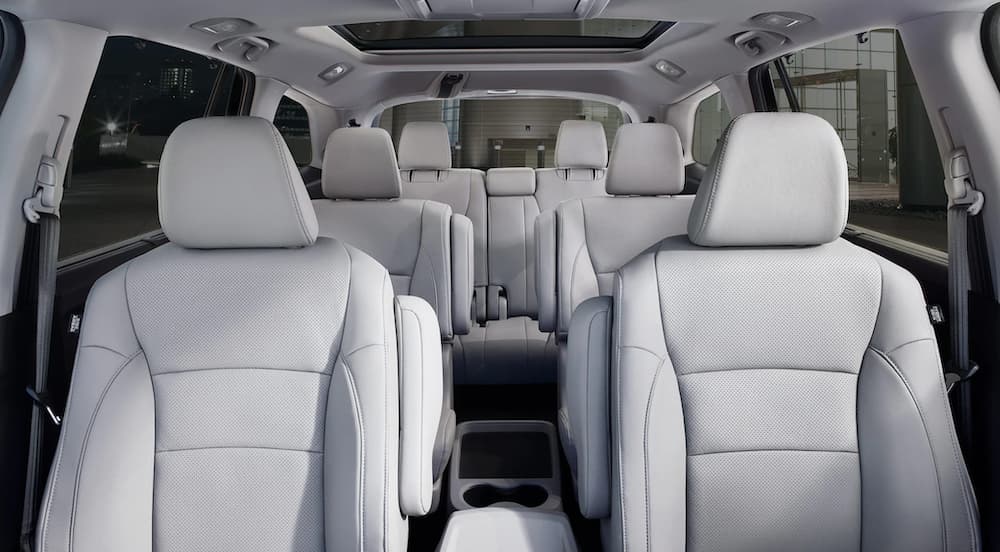 The white interior of a 2020 Honda Pilot is shown.