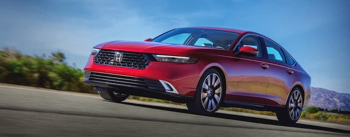 A red 2022 Honda Accord is shown from the front after leaving a Farmerville Honda Dealer.