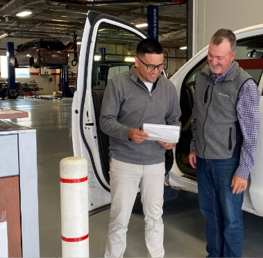 Service technician talking with customer.