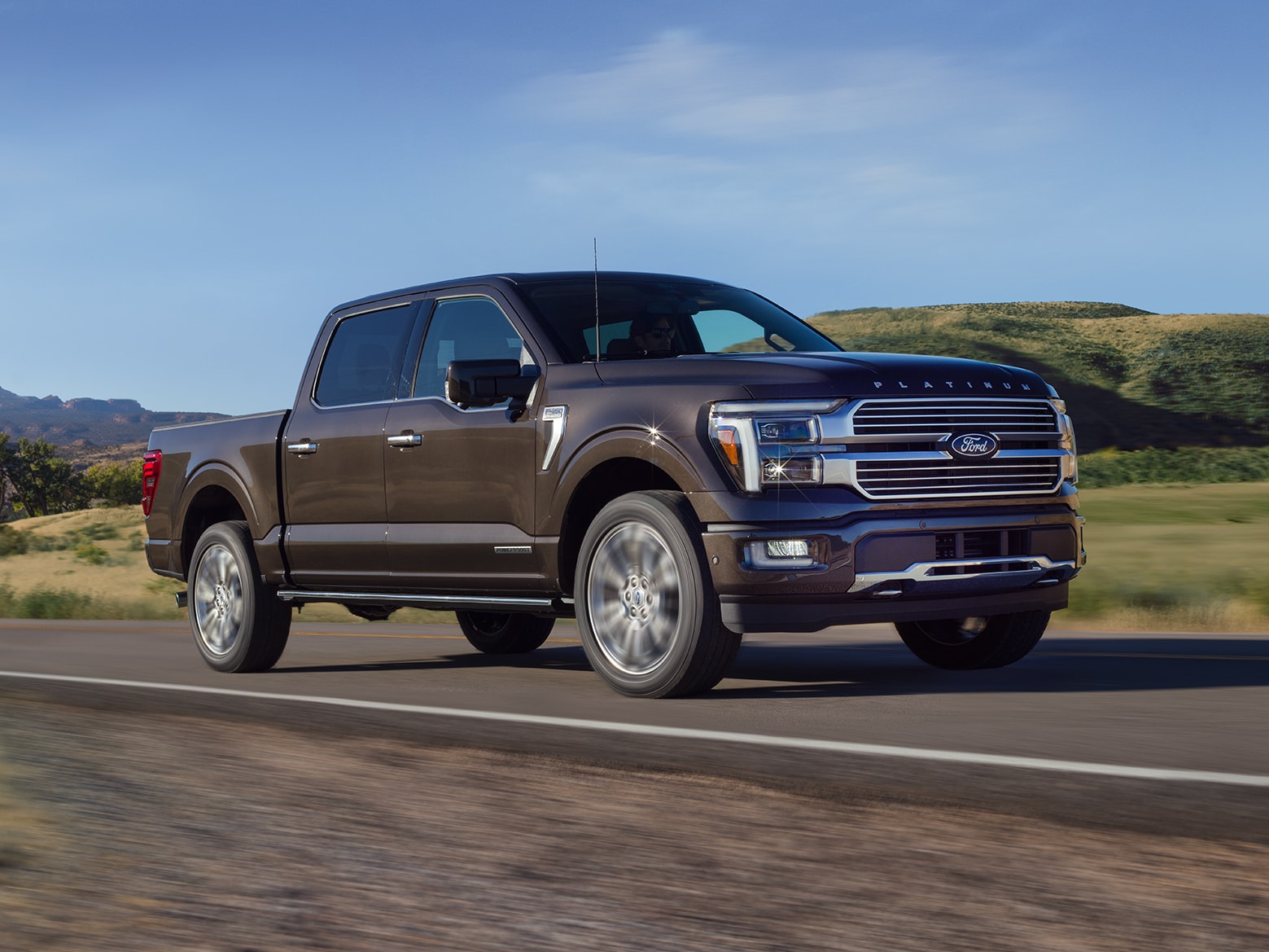 Man driving a 2025 Ford F-150® King Ranch® showing the center stack display screen