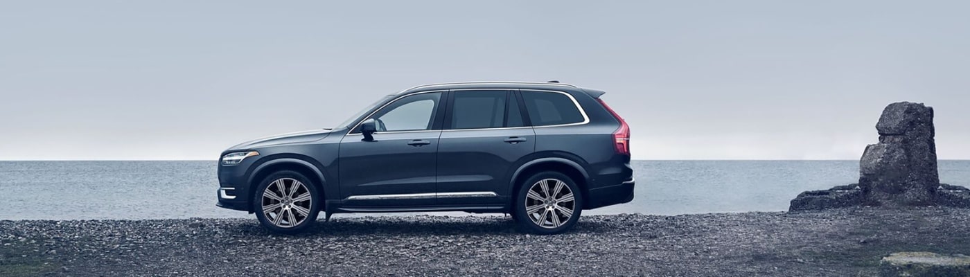 Volvo XC90 parked on rocky beach