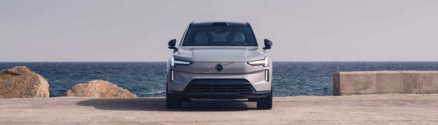 Volvo EX90 SUV parked next overlooking the sea
