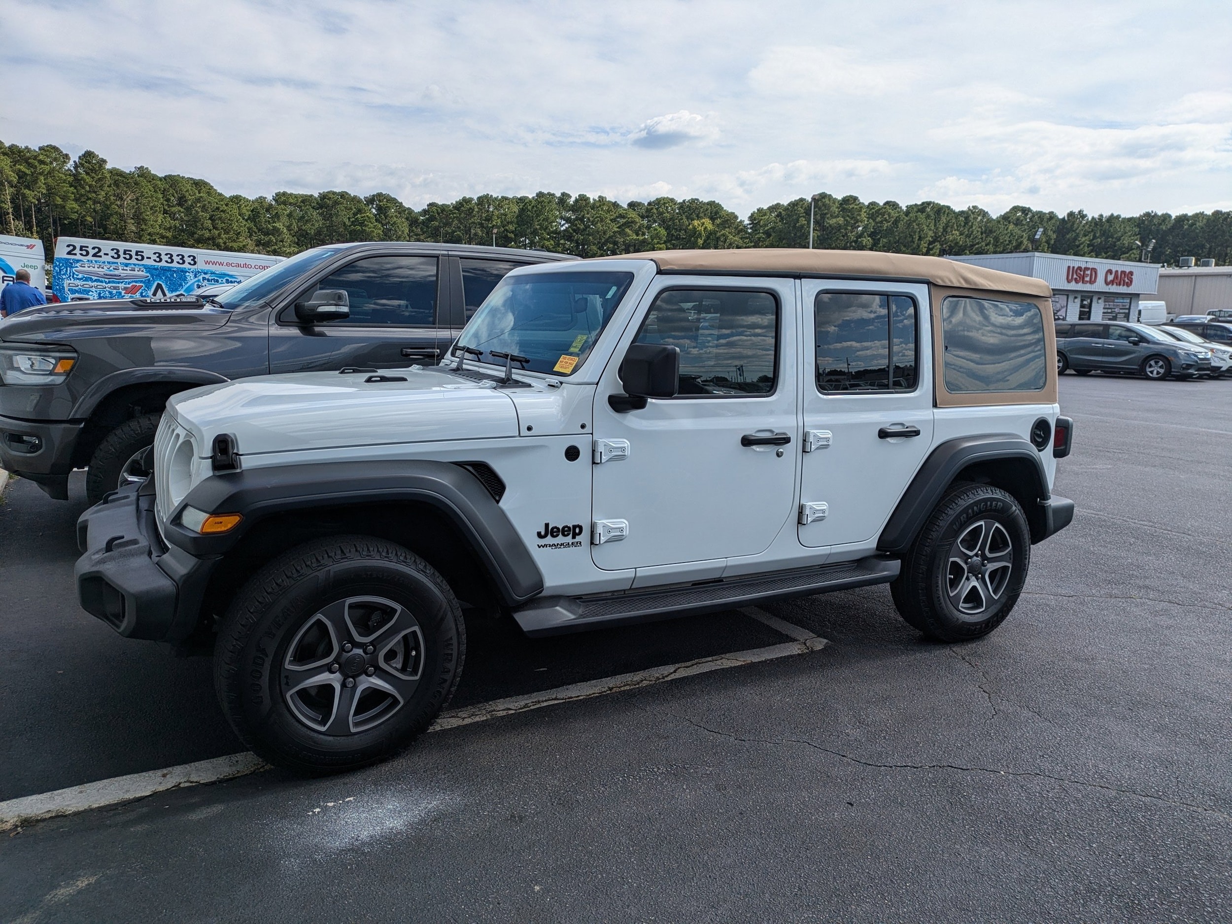 Used 2020 Jeep Wrangler Unlimited Black and Tan with VIN 1C4HJXDG9LW201753 for sale in Greenville, NC