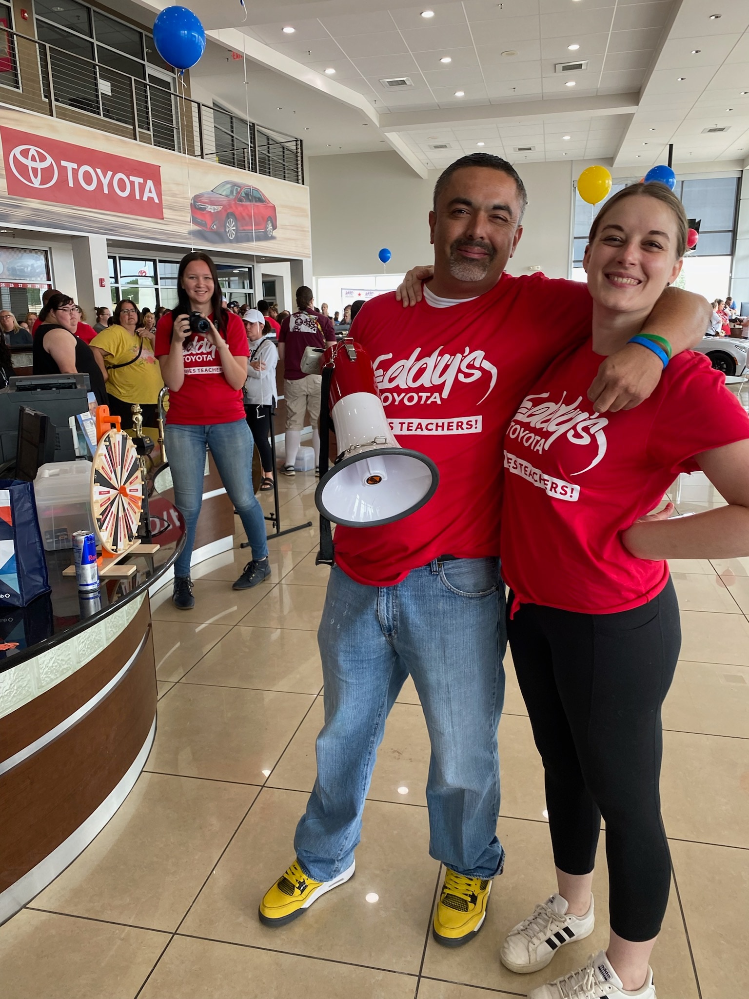 Eddy's Toyota Employees Posing With A Mega Phone