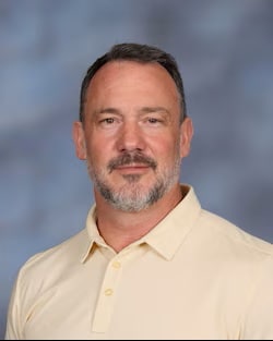 Staff member Sid Smith from 7524edb65f55