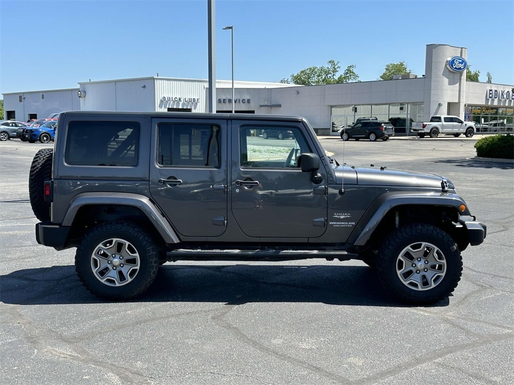 Used 2014 Jeep Wrangler Unlimited Sahara with VIN 1C4BJWEG6EL244109 for sale in Greenville, MI