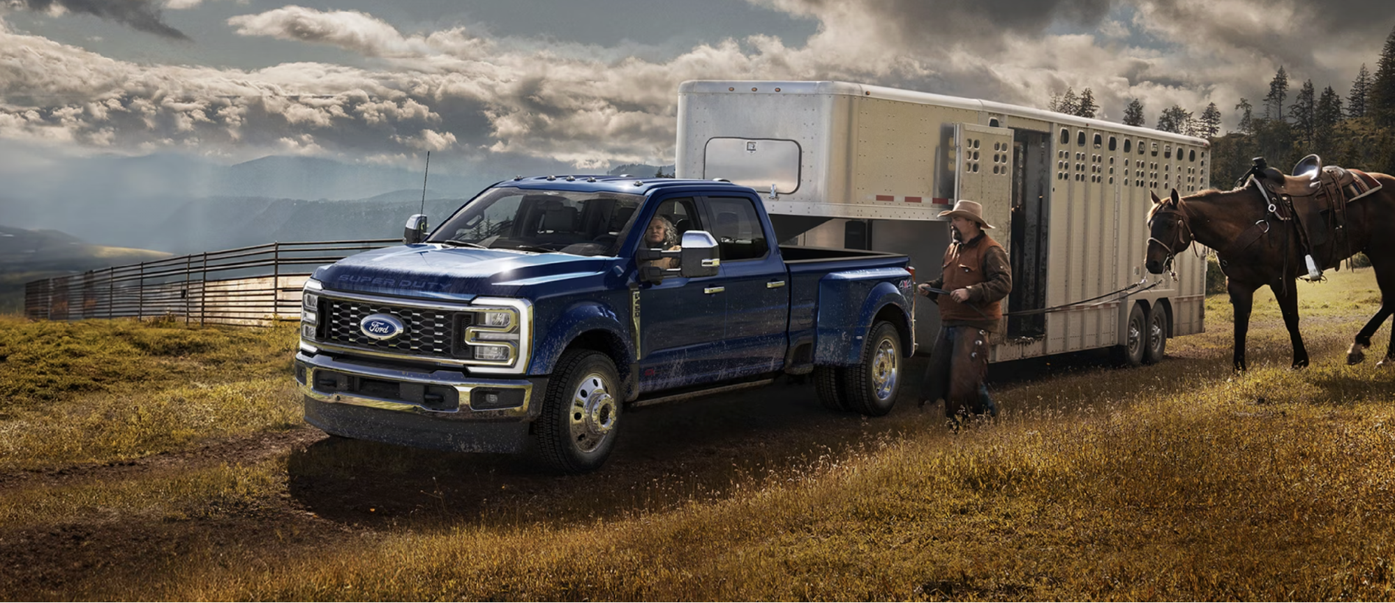 The 2026 Ford Super Duty in a mountainous ranch hauling a trailer