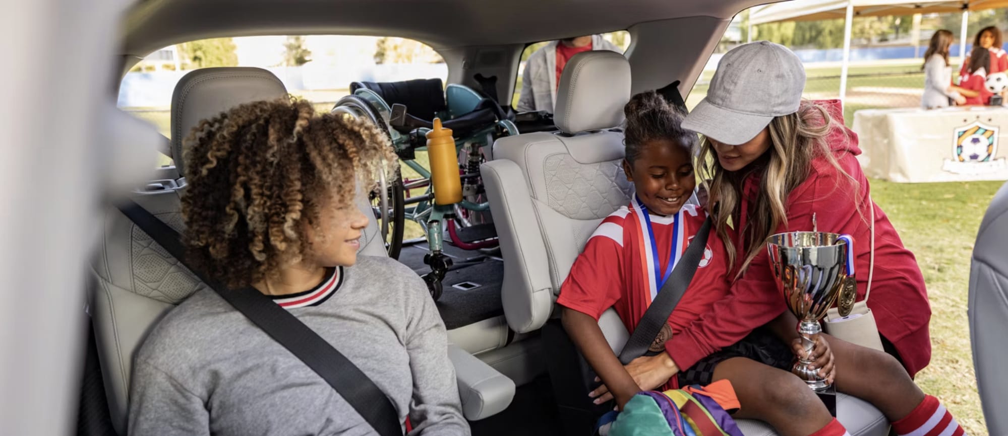 Family enjoying a comfortable Ford interior after a soccer match
