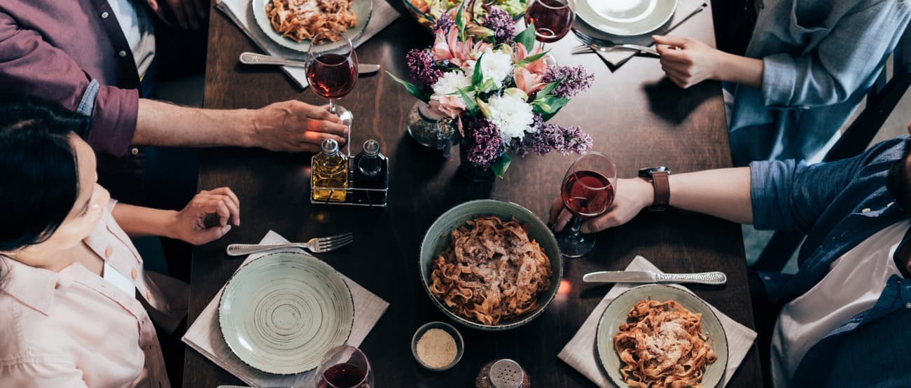 a family sitting down to breakfast