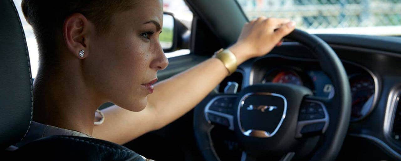 women in drivers seat of Dodge Charger