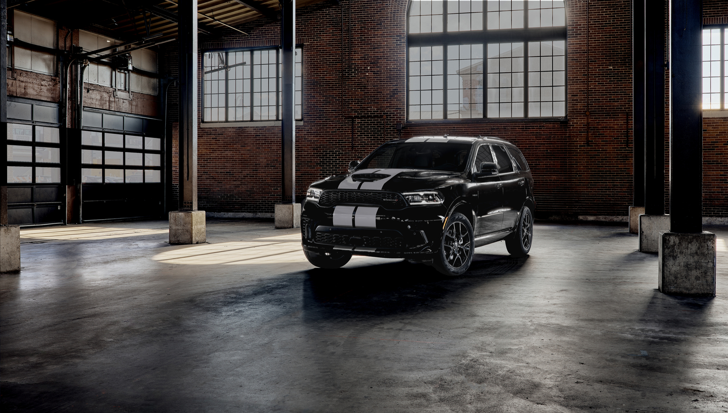 Black Dodge Durango in a warehouse at night
