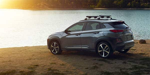 2019 Hyundai Kona SUV parked at a lake at sunset