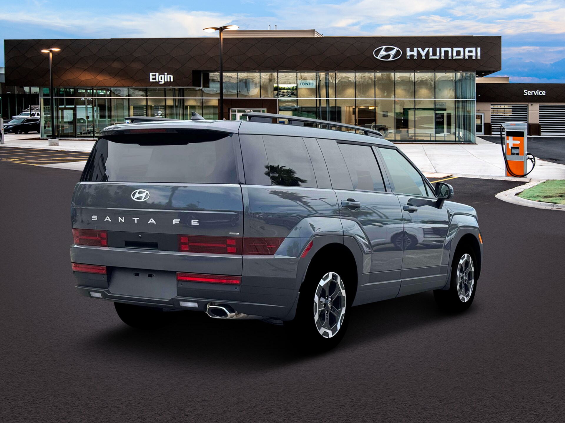 Gray Hyundai Santa Fe viewed from the rear passenger-side angle
