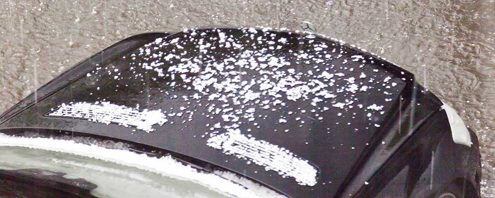 hail on black car