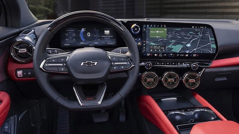 2024 Chevrolet Blazer EV infotainment features with red interior seating