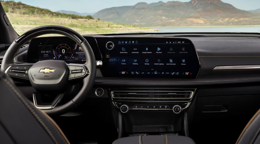 Wide dashboard view of the 2027 Chevrolet Traverse showing the standard 17.7-inch infotainment touchscreen with Google built-in apps, climate controls, and 11-inch driver display at Elkins Chevrolet near Marlton, NJ.
