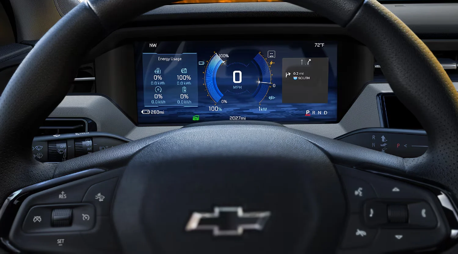 IDriver perspective of the 11-inch digital instrument cluster on the 2027 Chevy Bolt showing battery range, speedometer, and energy usage at Elkins Chevrolet near Marlton, NJ