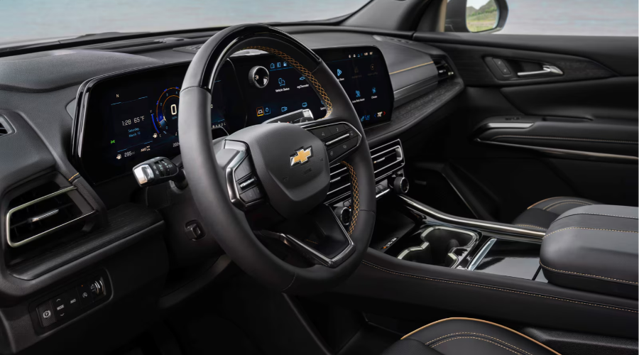 Interior cockpit view of the 2027 Chevrolet Traverse featuring a standard 17.7-inch touchscreen display, 11-inch digital gauge cluster, and leather-wrapped steering wheel available at Elkins Chevrolet near Marlton, New Jersey.