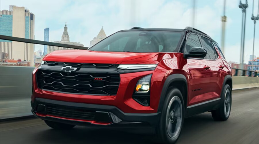Side profile of a 2026 Chevrolet Equinox RS in Marlton accelerating safely through suburban highway traffic lanes