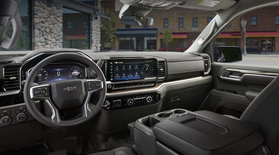 Spacious front cabin interior of a 2026 Chevy Silverado 1500 featuring a 13.4-inch touchscreen display and digital instrument cluster at Elkins Chevrolet in Marlton, NJ.