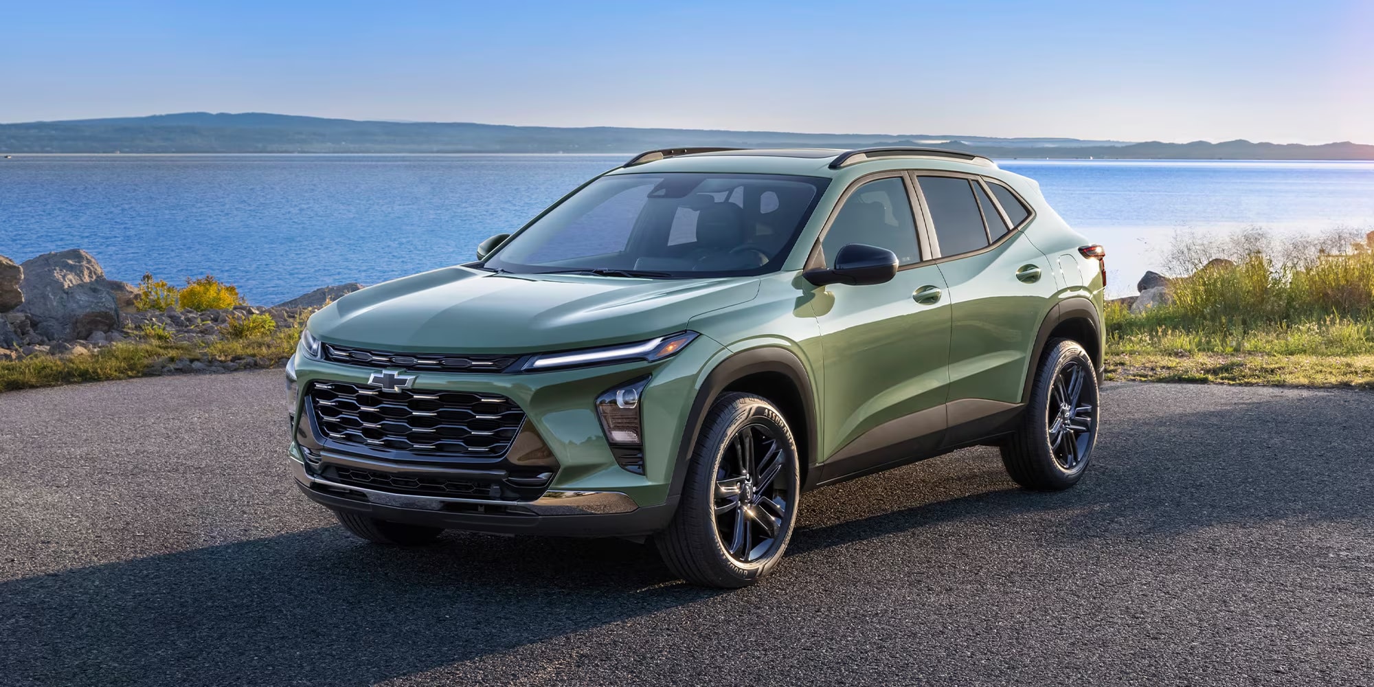 Front profile view of a 2026 Chevrolet Trax crossover driving through South Jersey near Marlton showing its modern grille and sleek headlights.