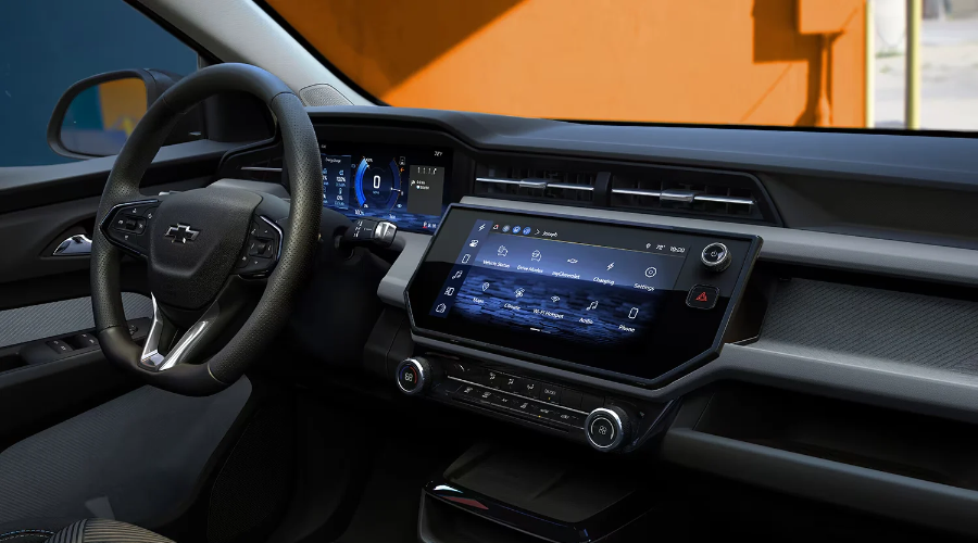 Modern 2027 Chevy Bolt interior featuring an 11.3-inch touchscreen display, digital driver cluster, and leather-wrapped steering wheel, available at Elkins Chevrolet near Marlton, NJ