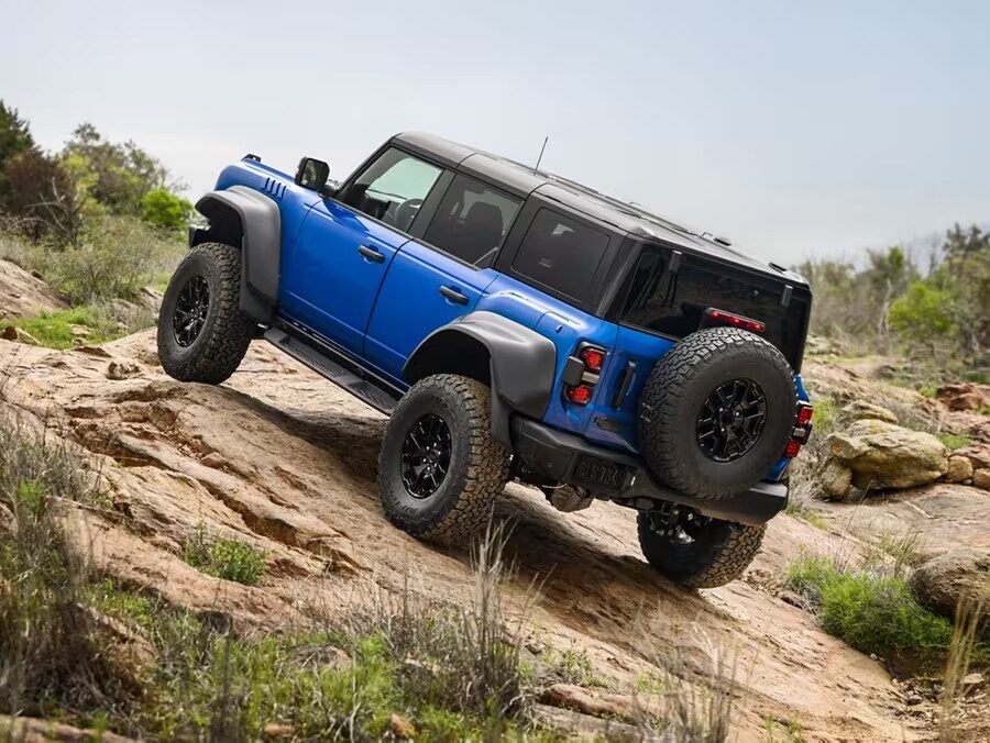 Ford Bronco driving on rocky terrain