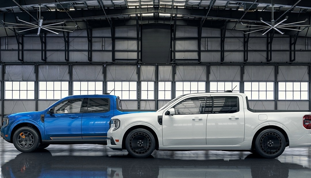 2025 Ford Maverick trucks parked in a warehouse under some ceiling fans