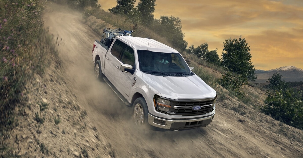 2025 Ford F-150 driving down a dirt road