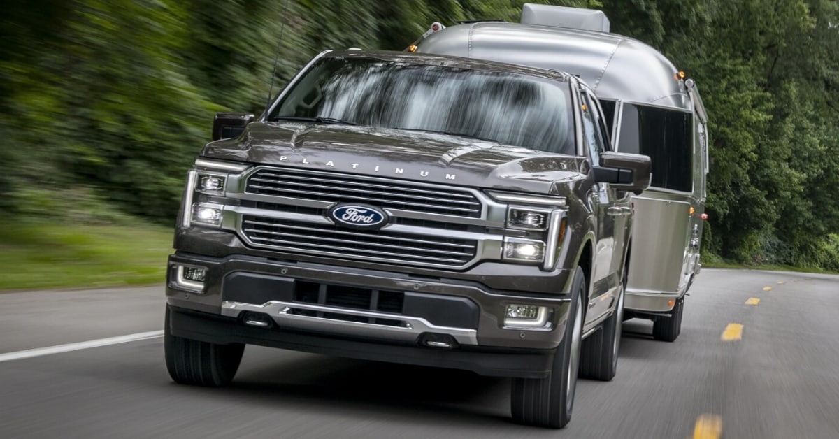 2025 Ford F-150 towing a trailer through the forest