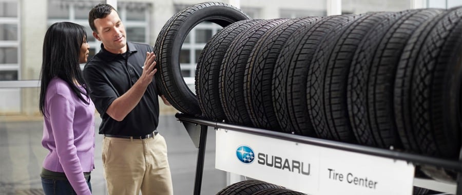 Subaru tire store sales person and customer