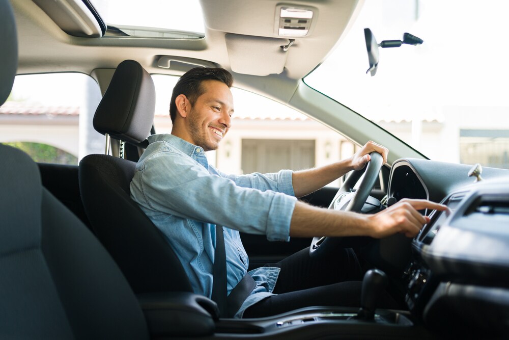 happy man driving his car