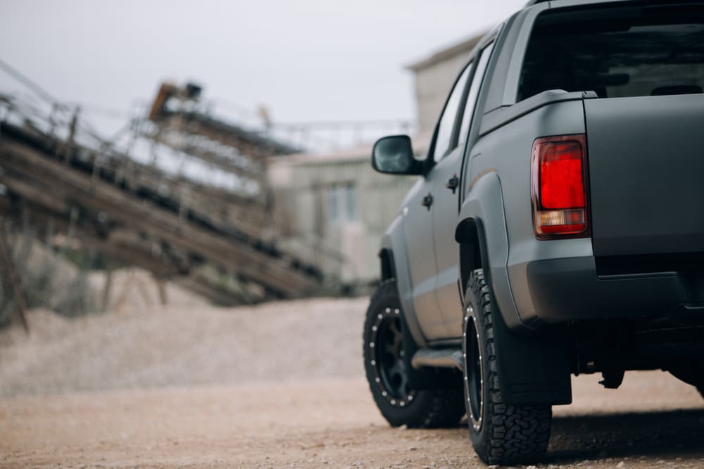 behind view of a truck in a rugged terrain