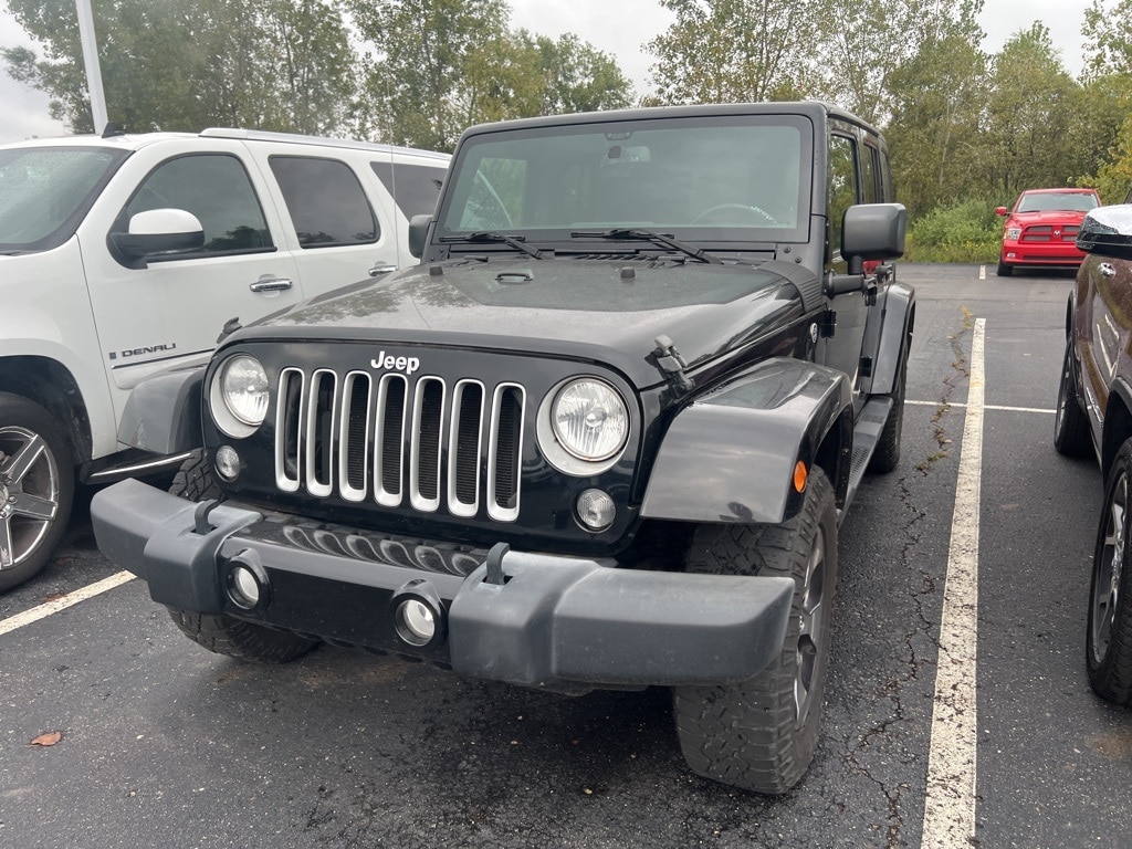 Used 2016 Jeep Wrangler Unlimited Sahara with VIN 1C4BJWEG2GL201423 for sale in Jackson, MI