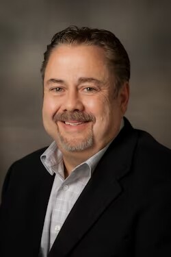 Staff member Mark Trudell from ID_d1a712