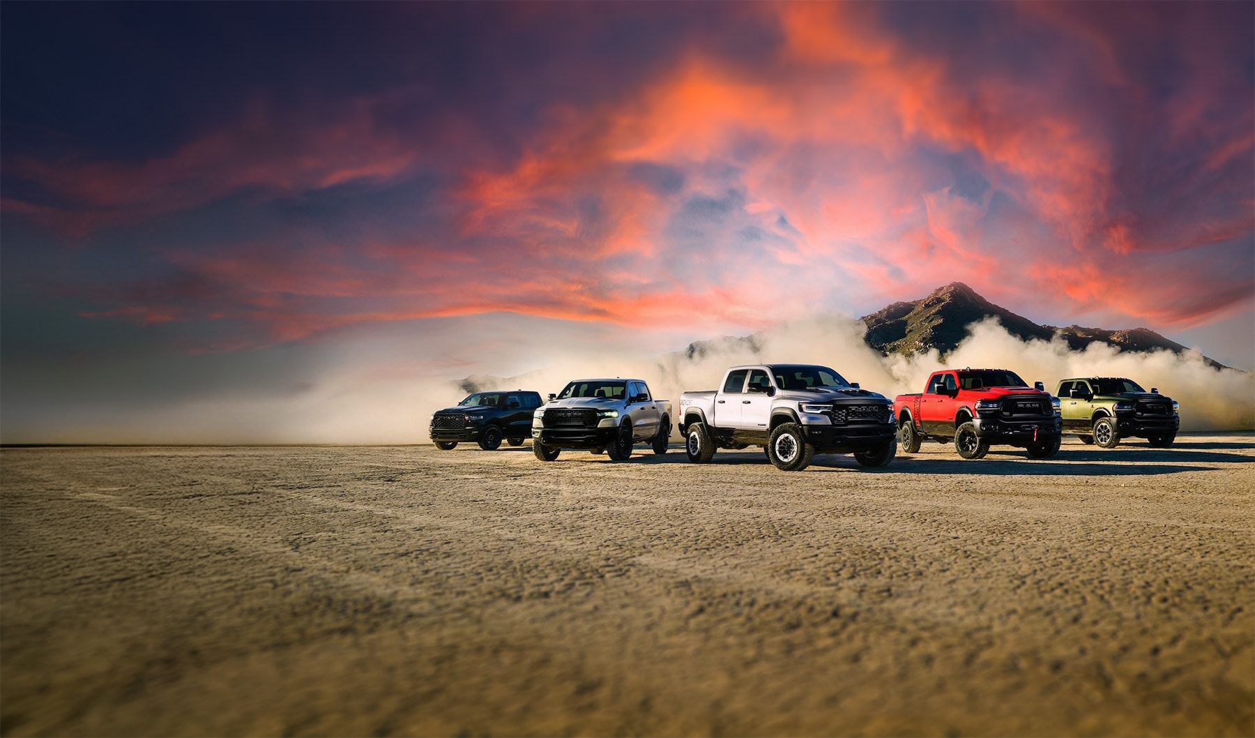darkened-expanded-2025-RAM-1500-hero-1500-models-parked-in-the-desert.jpg