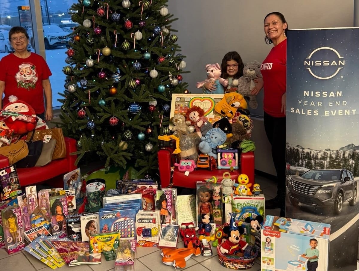  Person cheerfully signing documents.