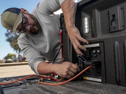 2024 Ford F150® PowerBoost® Hybrid pickup being driven on an open road