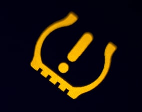 yellow warning light on dashboard