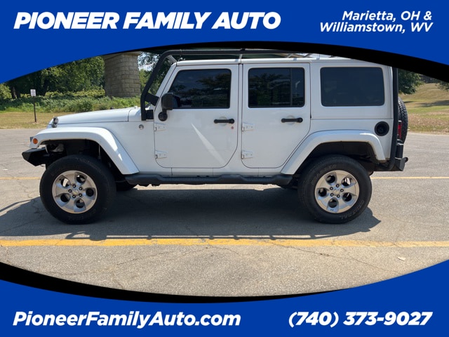 Used 2014 Jeep Wrangler Unlimited Sahara with VIN 1C4BJWEG2EL291167 for sale in Marietta, OH