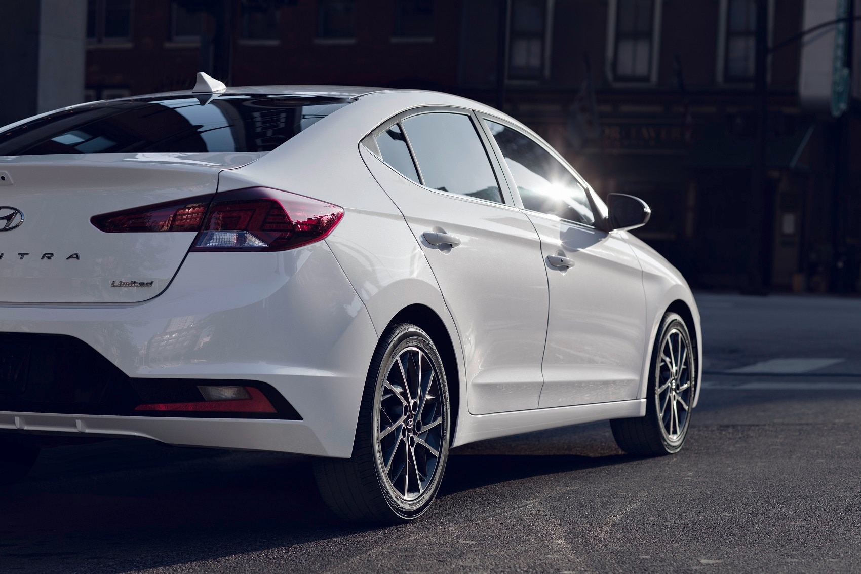 White Hyundai Elantra Limited driving on a road Hyundai Elantra Exterior Style