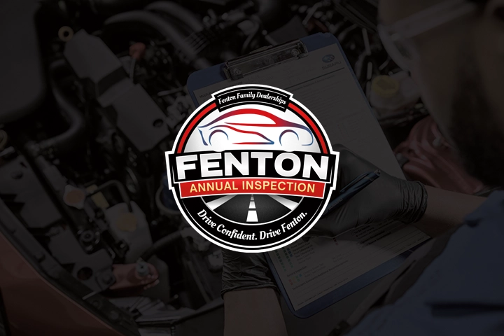 Fenton Annual Inspection logo overlayed on top of an image of a Subaru service technician performing a multi-point inspection