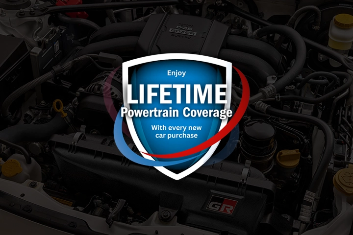Lifetime Powertrain Coverage logo overlayed on top of an image of a Toyota engine bay