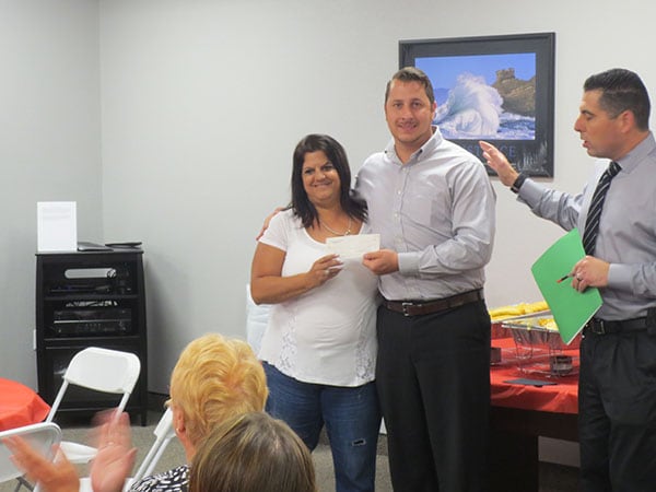 Photo of Event organizers receiving donations for charitable organizations at Ferman New Port Richey