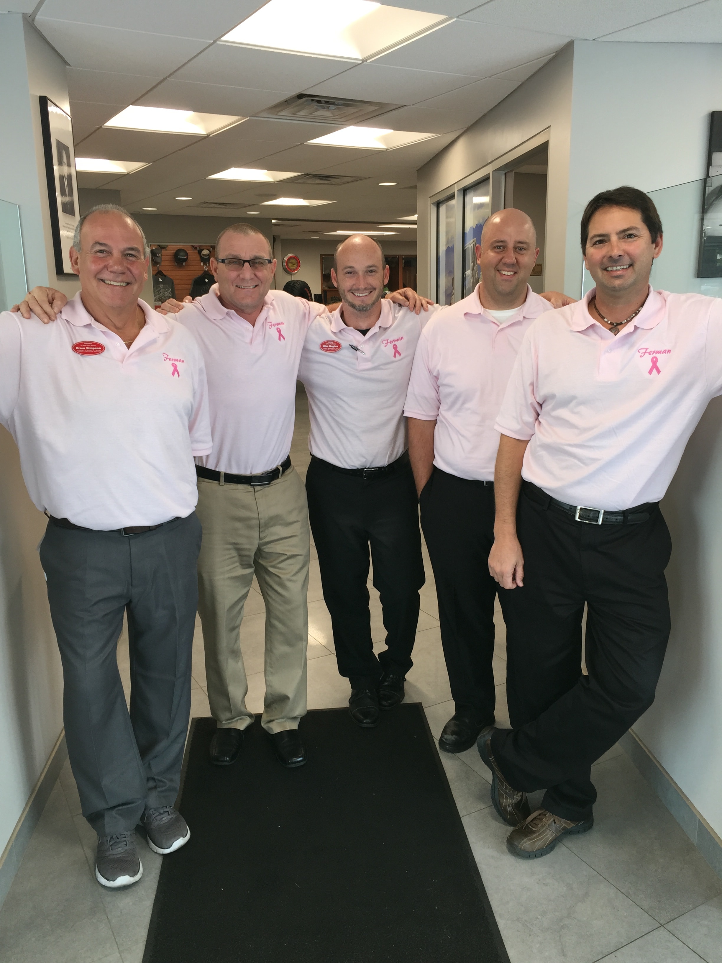 Photo of Ferman Chrysler Jeep Dodge RAM of New Port Richey employees wearing pink in support of Breast Cancer Awareness Month