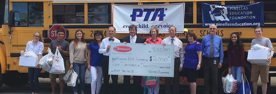 Photo of Pinellas County Students and staff receiving donation 