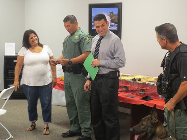 Photo of Event organizers receiving donations for charitable organizations at Ferman New Port Richey