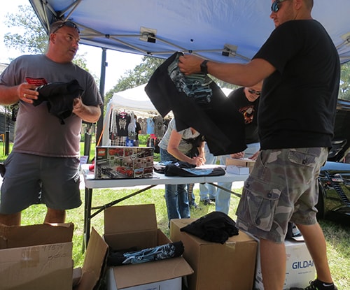 photo of Ferman Volvo handing out complimentary t-shirts at a local Cotee River Bikefest